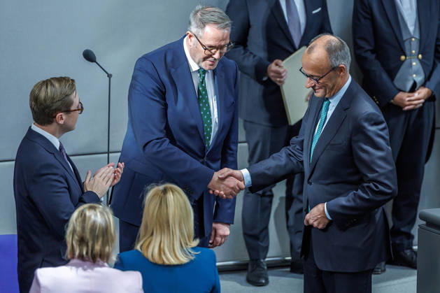 Bundestag: Federal Chancellor Friedrich Merz (CDU) and Alexander Schweitzer (SPD), Federal Minister of Labor and Social Affairs, after being sworn in at the German Bundestag on October 14, 2026, in Berlin, Berlin, Berlin, Germany, Bundestag