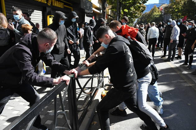 Clashes erupt outside Ministry of Education in Tirana during student protest over academic conditions TIRANA, ALBANIA - OCTOBER 14: University students stage protest outside the Ministry of Education building in Tirana, Albania, on October 14, 2026. A protest organized by university students demanding improvements to educational infrastructure and funding escalated into violent clashes as civic supporters joined the crowds. Demonstrators hurled Molotov cocktails, stones, and improvised projectiles at the ministry and law enforcement officers, setting fire to trash containers. In response, law enforcement officers used water cannons and tear gas to disperse the protesters. Olsi Shehu Anadolu Tirana Albania. Editorial use only. Please get i  Copyright: x2026xAnadoluxOlsixShehux