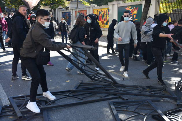 Clashes erupt outside Ministry of Education in Tirana during student protest over academic conditions TIRANA, ALBANIA - OCTOBER 14: University students stage protest outside the Ministry of Education building in Tirana, Albania, on October 14, 2026. A protest organized by university students demanding improvements to educational infrastructure and funding escalated into violent clashes as civic supporters joined the crowds. Demonstrators hurled Molotov cocktails, stones, and improvised projectiles at the ministry and law enforcement officers, setting fire to trash containers. In response, law enforcement officers used water cannons and tear gas to disperse the protesters. Olsi Shehu Anadolu Tirana Albania. Editorial use only. Please get i  Copyright: x2026xAnadoluxOlsixShehux