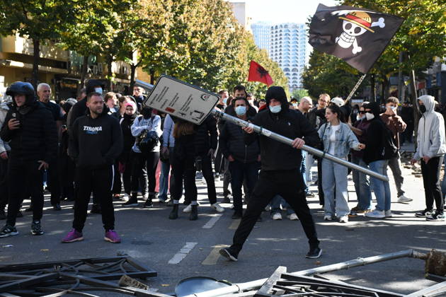Clashes erupt outside Ministry of Education in Tirana during student protest over academic conditions TIRANA, ALBANIA - OCTOBER 14: University students stage protest outside the Ministry of Education building in Tirana, Albania, on October 14, 2026. A protest organized by university students demanding improvements to educational infrastructure and funding escalated into violent clashes as civic supporters joined the crowds. Demonstrators hurled Molotov cocktails, stones, and improvised projectiles at the ministry and law enforcement officers, setting fire to trash containers. In response, law enforcement officers used water cannons and tear gas to disperse the protesters. Olsi Shehu Anadolu Tirana Albania. Editorial use only. Please get i  Copyright: x2026xAnadoluxOlsixShehux