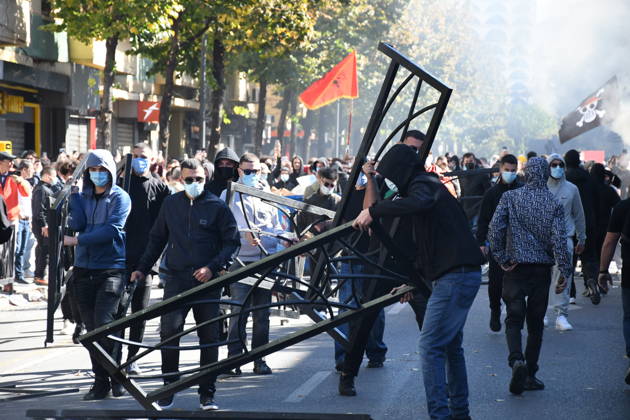 Clashes erupt outside Ministry of Education in Tirana during student protest over academic conditions TIRANA, ALBANIA - OCTOBER 14: University students stage protest outside the Ministry of Education building in Tirana, Albania, on October 14, 2026. A protest organized by university students demanding improvements to educational infrastructure and funding escalated into violent clashes as civic supporters joined the crowds. Demonstrators hurled Molotov cocktails, stones, and improvised projectiles at the ministry and law enforcement officers, setting fire to trash containers. In response, law enforcement officers used water cannons and tear gas to disperse the protesters. Olsi Shehu Anadolu Tirana Albania. Editorial use only. Please get i  Copyright: x2026xAnadoluxOlsixShehux