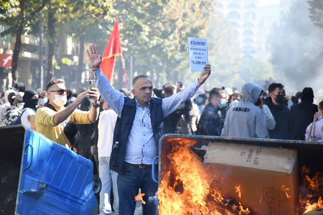 Clashes erupt outside Ministry of Education in Tirana during student protest over academic conditions TIRANA, ALBANIA - OCTOBER 14: University students stage protest outside the Ministry of Education building in Tirana, Albania, on October 14, 2026. A protest organized by university students demanding improvements to educational infrastructure and funding escalated into violent clashes as civic supporters joined the crowds. Demonstrators hurled Molotov cocktails, stones, and improvised projectiles at the ministry and law enforcement officers, setting fire to trash containers. In response, law enforcement officers used water cannons and tear gas to disperse the protesters. Olsi Shehu Anadolu Tirana Albania. Editorial use only. Please get i  Copyright: x2026xAnadoluxOlsixShehux