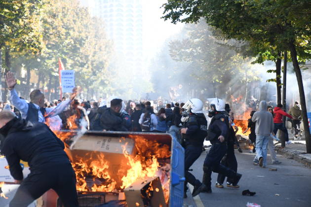 Clashes erupt outside Ministry of Education in Tirana during student protest over academic conditions TIRANA, ALBANIA - OCTOBER 14: University students stage protest outside the Ministry of Education building in Tirana, Albania, on October 14, 2026. A protest organized by university students demanding improvements to educational infrastructure and funding escalated into violent clashes as civic supporters joined the crowds. Demonstrators hurled Molotov cocktails, stones, and improvised projectiles at the ministry and law enforcement officers, setting fire to trash containers. In response, law enforcement officers used water cannons and tear gas to disperse the protesters. Olsi Shehu Anadolu Tirana Albania. Editorial use only. Please get i  Copyright: x2026xAnadoluxOlsixShehux