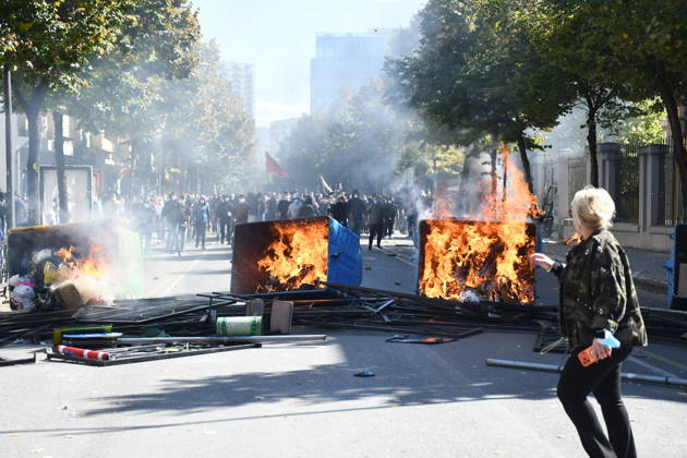 Clashes erupt outside Ministry of Education in Tirana during student protest over academic conditions TIRANA, ALBANIA - OCTOBER 14: University students stage protest outside the Ministry of Education building in Tirana, Albania, on October 14, 2026. A protest organized by university students demanding improvements to educational infrastructure and funding escalated into violent clashes as civic supporters joined the crowds. Demonstrators hurled Molotov cocktails, stones, and improvised projectiles at the ministry and law enforcement officers, setting fire to trash containers. In response, law enforcement officers used water cannons and tear gas to disperse the protesters. Olsi Shehu Anadolu Tirana Albania. Editorial use only. Please get i  Copyright: x2026xAnadoluxOlsixShehux