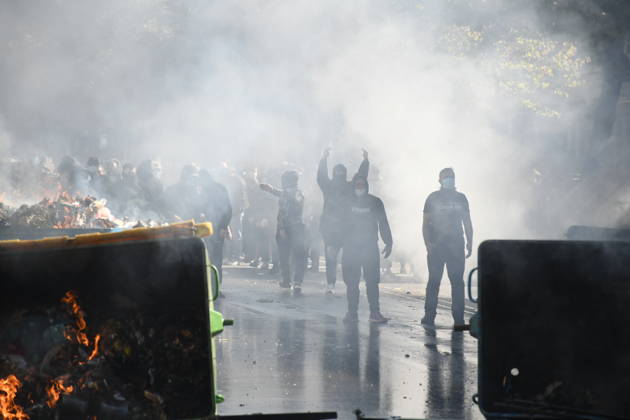 Clashes erupt outside Ministry of Education in Tirana during student protest over academic conditions TIRANA, ALBANIA - OCTOBER 14: University students stage protest outside the Ministry of Education building in Tirana, Albania, on October 14, 2026. A protest organized by university students demanding improvements to educational infrastructure and funding escalated into violent clashes as civic supporters joined the crowds. Demonstrators hurled Molotov cocktails, stones, and improvised projectiles at the ministry and law enforcement officers, setting fire to trash containers. In response, law enforcement officers used water cannons and tear gas to disperse the protesters. Olsi Shehu Anadolu Tirana Albania. Editorial use only. Please get i  Copyright: x2026xAnadoluxOlsixShehux