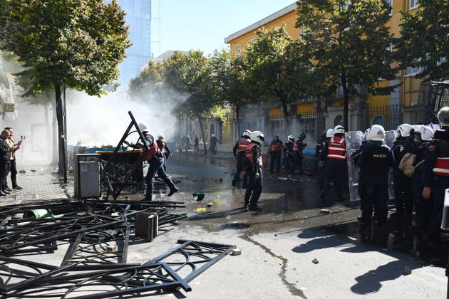 Clashes erupt outside Ministry of Education in Tirana during student protest over academic conditions TIRANA, ALBANIA - OCTOBER 14: University students stage protest outside the Ministry of Education building in Tirana, Albania, on October 14, 2026. A protest organized by university students demanding improvements to educational infrastructure and funding escalated into violent clashes as civic supporters joined the crowds. Demonstrators hurled Molotov cocktails, stones, and improvised projectiles at the ministry and law enforcement officers, setting fire to trash containers. In response, law enforcement officers used water cannons and tear gas to disperse the protesters. Olsi Shehu Anadolu Tirana Albania. Editorial use only. Please get i  Copyright: x2026xAnadoluxOlsixShehux
