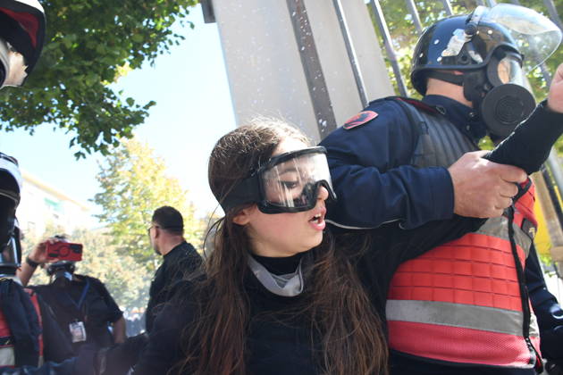 Clashes erupt outside Ministry of Education in Tirana during student protest over academic conditions TIRANA, ALBANIA - OCTOBER 14: University students stage protest outside the Ministry of Education building in Tirana, Albania, on October 14, 2026. A protest organized by university students demanding improvements to educational infrastructure and funding escalated into violent clashes as civic supporters joined the crowds. Demonstrators hurled Molotov cocktails, stones, and improvised projectiles at the ministry and law enforcement officers, setting fire to trash containers. In response, law enforcement officers used water cannons and tear gas to disperse the protesters. Olsi Shehu Anadolu Tirana Albania. Editorial use only. Please get i  Copyright: x2026xAnadoluxOlsixShehux