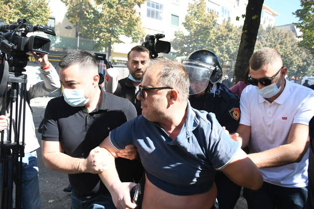 Clashes erupt outside Ministry of Education in Tirana during student protest over academic conditions TIRANA, ALBANIA - OCTOBER 14: University students stage protest outside the Ministry of Education building in Tirana, Albania, on October 14, 2026. A protest organized by university students demanding improvements to educational infrastructure and funding escalated into violent clashes as civic supporters joined the crowds. Demonstrators hurled Molotov cocktails, stones, and improvised projectiles at the ministry and law enforcement officers, setting fire to trash containers. In response, law enforcement officers used water cannons and tear gas to disperse the protesters. Olsi Shehu Anadolu Tirana Albania. Editorial use only. Please get i  Copyright: x2026xAnadoluxOlsixShehux