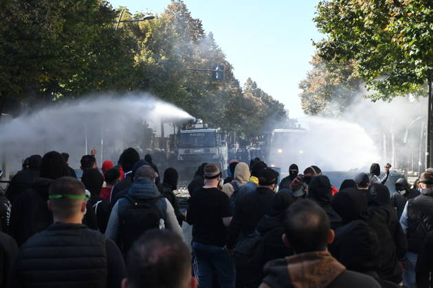 Clashes erupt outside Ministry of Education in Tirana during student protest over academic conditions TIRANA, ALBANIA - OCTOBER 14: University students stage protest outside the Ministry of Education building in Tirana, Albania, on October 14, 2026. A protest organized by university students demanding improvements to educational infrastructure and funding escalated into violent clashes as civic supporters joined the crowds. Demonstrators hurled Molotov cocktails, stones, and improvised projectiles at the ministry and law enforcement officers, setting fire to trash containers. In response, law enforcement officers used water cannons and tear gas to disperse the protesters. Olsi Shehu Anadolu Tirana Albania. Editorial use only. Please get i  Copyright: x2026xAnadoluxOlsixShehux