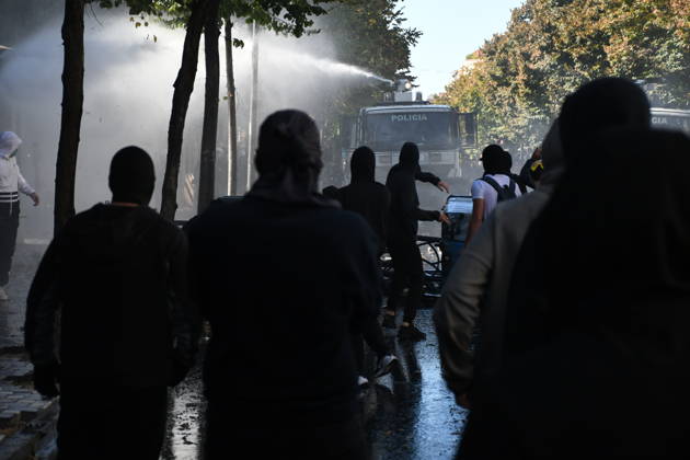 Clashes erupt outside Ministry of Education in Tirana during student protest over academic conditions TIRANA, ALBANIA - OCTOBER 14: University students stage protest outside the Ministry of Education building in Tirana, Albania, on October 14, 2026. A protest organized by university students demanding improvements to educational infrastructure and funding escalated into violent clashes as civic supporters joined the crowds. Demonstrators hurled Molotov cocktails, stones, and improvised projectiles at the ministry and law enforcement officers, setting fire to trash containers. In response, law enforcement officers used water cannons and tear gas to disperse the protesters. Olsi Shehu Anadolu Tirana Albania. Editorial use only. Please get i  Copyright: x2026xAnadoluxOlsixShehux