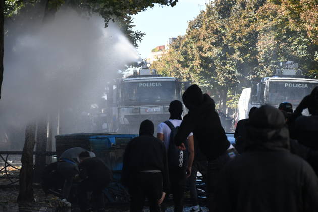 Clashes erupt outside Ministry of Education in Tirana during student protest over academic conditions TIRANA, ALBANIA - OCTOBER 14: University students stage protest outside the Ministry of Education building in Tirana, Albania, on October 14, 2026. A protest organized by university students demanding improvements to educational infrastructure and funding escalated into violent clashes as civic supporters joined the crowds. Demonstrators hurled Molotov cocktails, stones, and improvised projectiles at the ministry and law enforcement officers, setting fire to trash containers. In response, law enforcement officers used water cannons and tear gas to disperse the protesters. Olsi Shehu Anadolu Tirana Albania. Editorial use only. Please get i  Copyright: x2026xAnadoluxOlsixShehux
