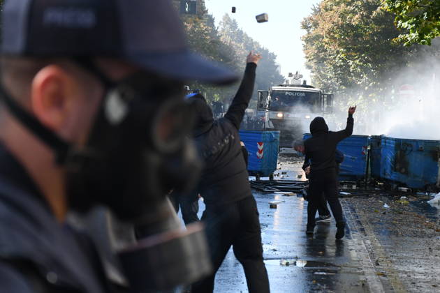 Clashes erupt outside Ministry of Education in Tirana during student protest over academic conditions TIRANA, ALBANIA - OCTOBER 14: University students stage protest outside the Ministry of Education building in Tirana, Albania, on October 14, 2026. A protest organized by university students demanding improvements to educational infrastructure and funding escalated into violent clashes as civic supporters joined the crowds. Demonstrators hurled Molotov cocktails, stones, and improvised projectiles at the ministry and law enforcement officers, setting fire to trash containers. In response, law enforcement officers used water cannons and tear gas to disperse the protesters. Olsi Shehu Anadolu Tirana Albania. Editorial use only. Please get i  Copyright: x2026xAnadoluxOlsixShehux