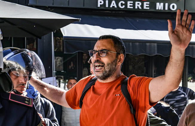 October 14, 2026, Tirana, Tirana, Albania: Arlind Qorri, leader of Movement Together (Levizja Bashke), a left-wing political party, gesture during a students protest in front of Education Ministry in Tirana, Albania, on 14 October, 2026. Students are in the second day of their protest calling for better education conditions and the resignation of Prime Minister Edi Rama. Movement Together (Levizja Bashke) was founded in 2022 by the political group Organizata Politike (Political Organisation) after 12 years of activism in social struggles and in solidarity with workers, students and citizens.....Students throw stones to police in front of Education Ministry in Tirana, Albania, on October 14, 2026. Students are in the second day of their prot - ZUMAb266 20261014_zip_b266_002 Copyright: xArmandoxBabanix