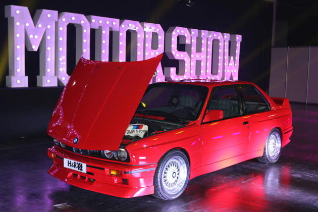 BMW M3 Evolution II Special Edition, limited to 500 units, 3 Series E30, model year 1988, Misanorot color, with the hood open, revealing the BMW M Power lettering from exhibitor H R Spezialfedern, Media event Carwalk for the Essen Motor Show on October 14, 2026, at Messe Essen in the run-up to the Essen Motor Show 2026 (November 28, 2026 – December 6, 2026), EM