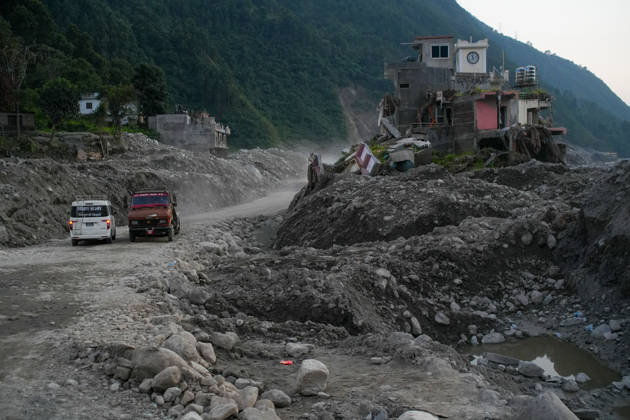 Aftermath of flash floods in Nepal NUWAKOT, NEPAL - OCTOBER 14 : Vehicles pass along a road near houses damaged by devastating flash floods in Betrabati, Nuwakot district, Nepal on October 14, 2026. Road and pedestrian connectivity has been restored with the construction of a new suspension bridge over the Trishuli River, allowing local residents to cross the river after the devastating floods damaged bridges and other infrastructure in the area. Sunil Pradhan Anadolu Nuwakot Nepal. Editorial use only. Please get in touch for any other usage.  Copyright: x2026xAnadoluxSunilxPradhanx