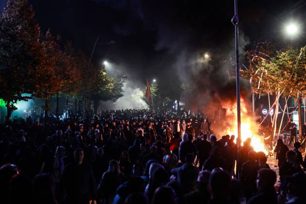 October 14, 2026, Tirana, Albania: TIRANA, ALBANIA, OCTOBER 14, 2026: Demonstrators clash with riot police during student-led protests over rising education costs, university conditions and alleged corruption in Tirana. Fires damage the Ministry of Education and bank premises as protesters throw stones and other objects, while police use tear gas and water cannons. Tirana Albania  - ZUMAq101 20261014_zna_q101_291 Copyright: xVlasovxSulajx