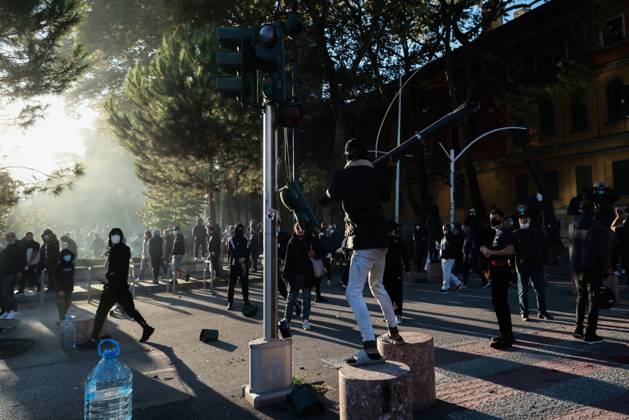 October 14, 2026, Tirana, Albania: TIRANA, ALBANIA, OCTOBER 14, 2026: Demonstrators clash with riot police during student-led protests over rising education costs, university conditions and alleged corruption in Tirana. Fires damage the Ministry of Education and bank premises as protesters throw stones and other objects, while police use tear gas and water cannons. Tirana Albania  - ZUMAq101 20261014_zna_q101_292 Copyright: xVlasovxSulajx