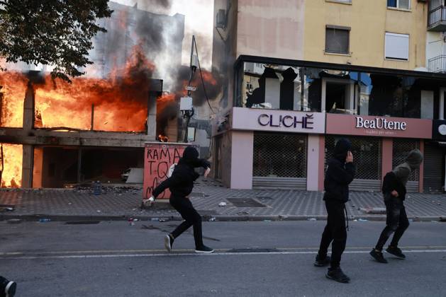October 14, 2026, Tirana, Albania: TIRANA, ALBANIA, OCTOBER 14, 2026: Demonstrators clash with riot police during student-led protests over rising education costs, university conditions and alleged corruption in Tirana. Fires damage the Ministry of Education and bank premises as protesters throw stones and other objects, while police use tear gas and water cannons. Tirana Albania - ZUMAq101 20261014_zna_q101_282 Copyright: xVlasovxSulajx