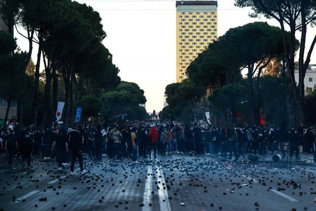 October 14, 2026, Tirana, Albania: TIRANA, ALBANIA, OCTOBER 14, 2026: Demonstrators clash with riot police during student-led protests over rising education costs, university conditions and alleged corruption in Tirana. Fires damage the Ministry of Education and bank premises as protesters throw stones and other objects, while police use tear gas and water cannons. Tirana Albania - ZUMAq101 20261014_zna_q101_286 Copyright: xVlasovxSulajx