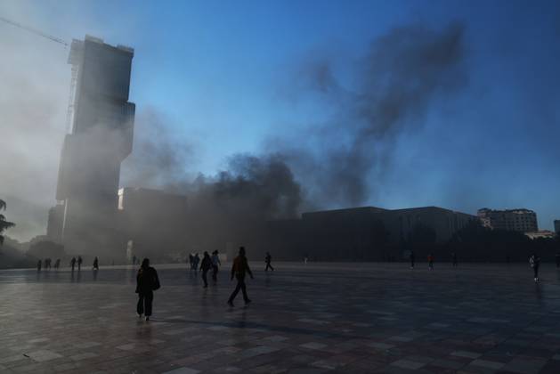 October 14, 2026, Tirana, Albania: TIRANA, ALBANIA, OCTOBER 14, 2026: Demonstrators clash with riot police during student-led protests over rising education costs, university conditions and alleged corruption in Tirana. Fires damage the Ministry of Education and bank premises as protesters throw stones and other objects, while police use tear gas and water cannons. Tirana Albania - ZUMAq101 20261014_zna_q101_288 Copyright: xVlasovxSulajx