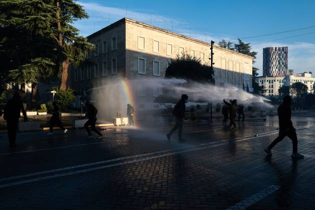 October 14, 2026, Tirana, Albania: TIRANA, ALBANIA, OCTOBER 14, 2026: Demonstrators clash with riot police during student-led protests over rising education costs, university conditions and alleged corruption in Tirana. Fires damage the Ministry of Education and bank premises as protesters throw stones and other objects, while police use tear gas and water cannons. Tirana Albania - ZUMAq101 20261014_zna_q101_289 Copyright: xVlasovxSulajx