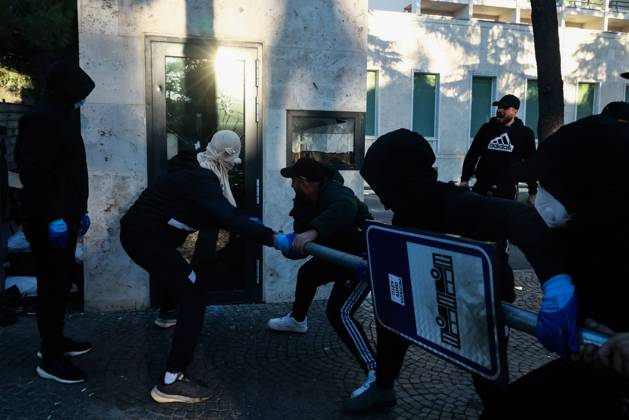 October 14, 2026, Tirana, Albania: TIRANA, ALBANIA, OCTOBER 14, 2026: Demonstrators clash with riot police during student-led protests over rising education costs, university conditions and alleged corruption in Tirana. Fires damage the Ministry of Education and bank premises as protesters throw stones and other objects, while police use tear gas and water cannons. Tirana Albania - ZUMAq101 20261014_zna_q101_297 Copyright: xVlasovxSulajx