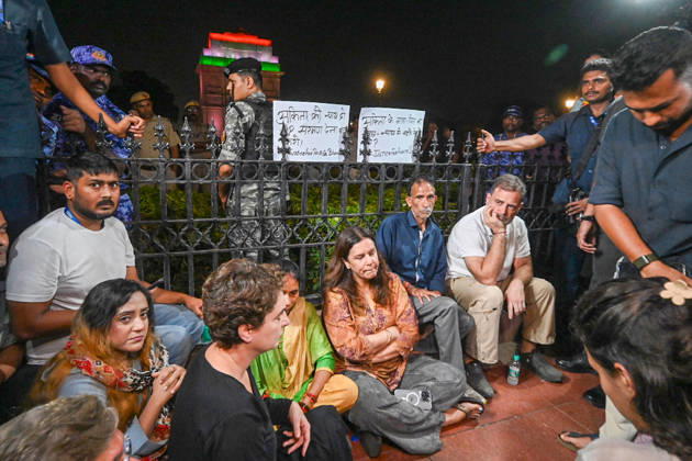NEW DELHI, INDIA - OCTOBER 14: Leader of the Opposition in the Lok Sabha Rahul Gandhi and Congress MP Priyanka Gandhi Vadra stage a sit-in demonstration alongside the family of Ankita Bhandari at India Gate on October 14, 2026 in New Delhi, India. Joined by party MPs and civil society activists, the Congress leaders expressed solidarity with the victim s parents, who organized the public vigil to demand a comprehensive central agency probe and an immediate halt to former BJP leader Dushyant Kumar Gautam s appointment as the Governor of Sikkim. (Photo by Arvind Yadav Hindustan Times) LoP Rahul Gandhi, MPs Join Family of Ankita Bhandari During Sit-in Demonstration At India Gate Against Appointment Of BJP Leader Dushyant Kumar Gautam As Govern