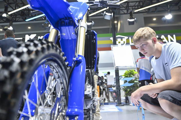 GUANGZHOU, CHINA - OCTOBER 15: Overseas buyers look at motorcycles displayed by Chinese motorcycle brand Zhangxue Motorcycle (ZXMOTO) during the 140th China Import and Export Fair (Canton Fair) on October 15, 2026 in Guangzhou, Guangdong Province of China. The fair runs in three phases until November 4, covering a total exhibition area of 1.55 million square meters.  Copyright: xChinaxNewsxServicex 111674432538
