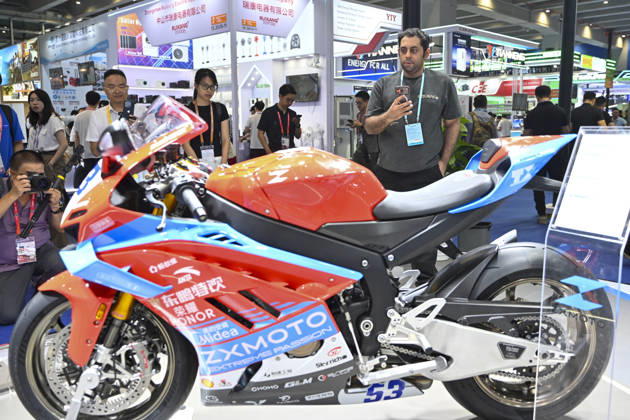 GUANGZHOU, CHINA - OCTOBER 15: Overseas buyers look at motorcycles displayed by Chinese motorcycle brand Zhangxue Motorcycle (ZXMOTO) during the 140th China Import and Export Fair (Canton Fair) on October 15, 2026 in Guangzhou, Guangdong Province of China. The fair runs in three phases until November 4, covering a total exhibition area of 1.55 million square meters.  Copyright: xChinaxNewsxServicex 111674432570