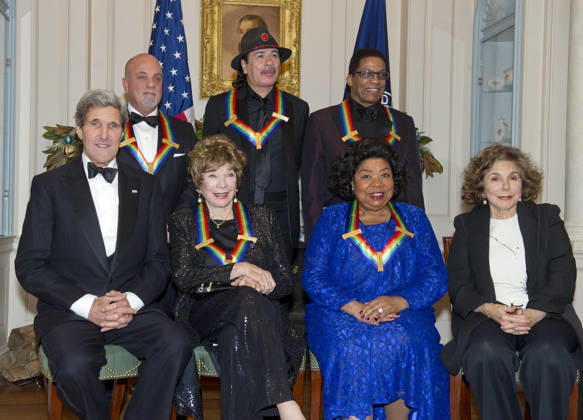 **FILE PHOTO** Martina Arroyo Has Passed Away. The five recipients of the 2013 Kennedy Center Honors pose for a group photo following a dinner hosted by United States Secretary of State John F. Kerry at the U.S. Department of State in Washington, D.C. on Saturday, December 1, 2013. The 2013 honorees are opera singer Martina Arroyo; pianist, keyboardist, bandleader and composer Herbie Hancock; pianist, singer and songwriter Billy Joel; actress Shirley MacLaine; and musician and songwriter Carlos Santana. Seated in the front row are: U.S. Secretary of State John Kerry, Shirley MacLain, Martina Arroyo, and Teresa Heinz Kerry. Standing are Billy Joel, Carlos Santana, and Herbie Hancock. Copyright: xCNP xMediaPunchx