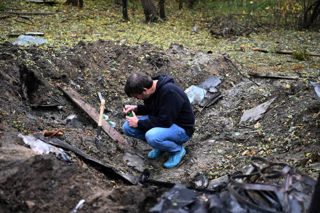 Aftermath Of A Russian Drone Attack In Kyiv, 15 Oct 2026 Workers operate at the site of a crater near a damaged residential building following the explosion of a Geran-5 jet-powered drone in Kyiv, Ukraine, on October 15, 2026. Kyiv Ukraine  Copyright: xOleksandrxGusevx originalFilename: gusev-notitle261015_np7A8.jpg