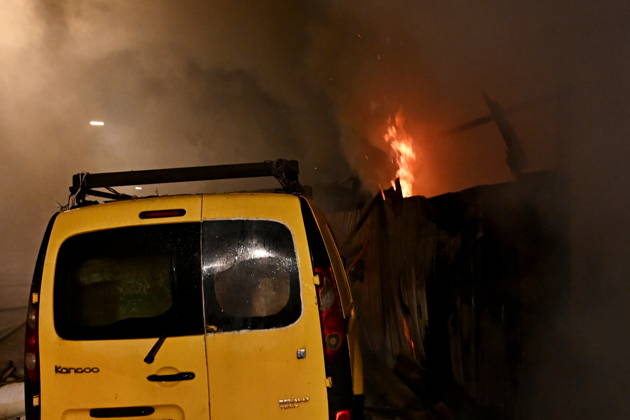 Russian Drone Attack On Kyiv, Ukraine Fire is visible near a damaged car at the scene of a blaze at a private residential house in the Shevchenkivskyi district, Kyiv, Ukraine, on October 15, 2026, following an explosion caused by a jet-powered drone launched by Russia. Kyiv Ukraine  Copyright: xOleksandrxGusevx originalFilename: gusev-notitle261015_npPPR.jpg