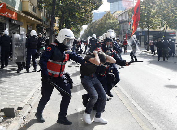 Protesters Clash with Police During a Demonstration in Tirana, Albania. Riot police detain a protester during an anti-government demonstration in central Tirana on October 15, 2026, as protests continued for a third consecutive day over university conditions and demands for the resignation of Albanian Prime Minister Edi Rama. The latest rally follows two nights of violence in the capital, during which protesters and riot police clashed, police used water cannons and tear gas, and demonstrators damaged government offices and shops and set fire to several buildings. Light Studio Agency Malton Dibra Tirana Albania Copyright: xLightxStudioxAgencyx xMaltonxDibrax