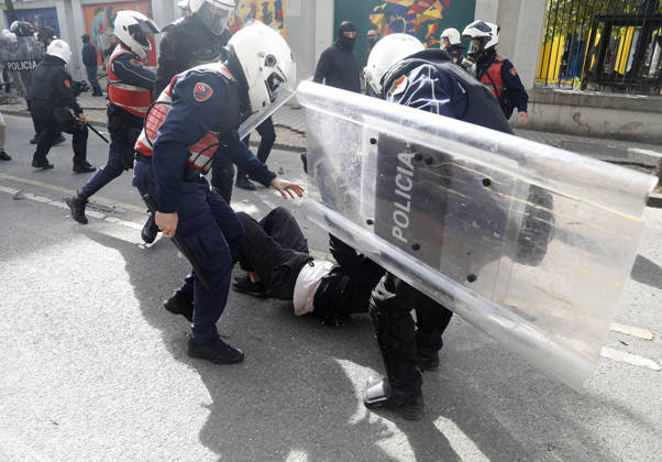 Protesters Clash with Police During a Demonstration in Tirana, Albania. Riot police detain a protester during an anti-government demonstration in central Tirana on October 15, 2026, as protests continued for a third consecutive day over university conditions and demands for the resignation of Albanian Prime Minister Edi Rama. The latest rally follows two nights of violence in the capital, during which protesters and riot police clashed, police used water cannons and tear gas, and demonstrators damaged government offices and shops and set fire to several buildings. Light Studio Agency Malton Dibra Tirana Albania Copyright: xLightxStudioxAgencyx xMaltonxDibrax