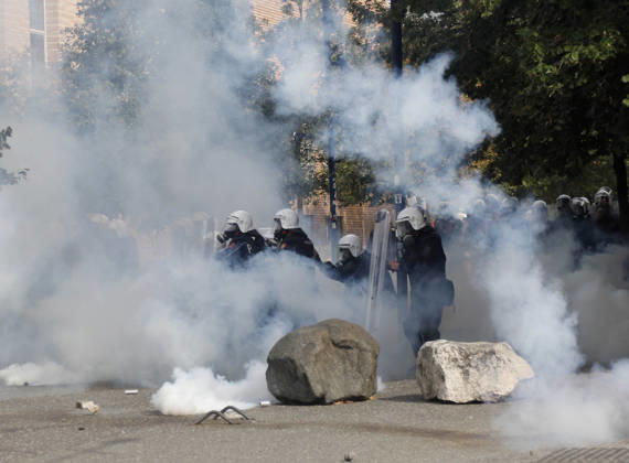 Protesters Clash with Police During a Demonstration in Tirana, Albania. Riot police officers take cover as protester throw back tear gas canisters during an anti-government demonstration in central Tirana on October 15, 2026, as protests continued for a third consecutive day over university conditions and demands for the resignation of Albanian Prime Minister Edi Rama. The latest rally follows two nights of violence in the capital, during which protesters and riot police clashed, police used water cannons and tear gas, and demonstrators damaged government offices and shops and set fire to several buildings. Light Studio Agency Malton Dibra Tirana Albania Copyright: xLightxStudioxAgencyx xMaltonxDibrax