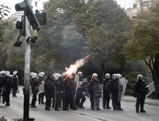 Protesters Clash with Police During a Demonstration in Tirana, Albania. Albanian riot police officers fire a tear gas canister during an anti-government demonstration in central Tirana on October 15, 2026, as protests continued for a third consecutive day over university conditions and demands for the resignation of Albanian Prime Minister Edi Rama. The latest rally follows two nights of violence in the capital, during which protesters and riot police clashed, police used water cannons and tear gas, and demonstrators damaged government offices and shops and set fire to several buildings. Light Studio Agency Malton Dibra Tirana Albania Copyright: xLightxStudioxAgencyx xMaltonxDibrax