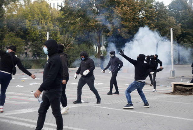 Protesters Clash with Police During a Demonstration in Tirana, Albania. Protesters throw stones at riot police during an anti-government demonstration in central Tirana on October 15, 2026, as protests continued for a third consecutive day over university conditions and demands for the resignation of Albanian Prime Minister Edi Rama. The latest rally follows two nights of violence in the capital, during which protesters and riot police clashed, police used water cannons and tear gas, and demonstrators damaged government offices and shops and set fire to several buildings. Light Studio Agency Malton Dibra Tirana Albania Copyright: xLightxStudioxAgencyx xMaltonxDibrax