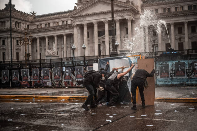 October 15, 2026, Buenos Aires, Buenos Aires, Argentina: Police forces deploy tear gas, water cannon trucks and rubber bullets against demonstrators during the Fifth Federal University March near Congress, as protesters demand the implementation of the University Funding Law and oppose President Javier Milei s austerity policies. The protest takes place amid the government s broader deregulation agenda, including Decree 70 2023 Buenos Aires Argentina - ZUMAf175 20261015_zip_f175_023 Copyright: xDaniellaxFernandezxRealinx