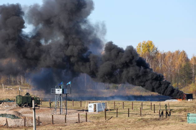 BELARUS - OCTOBER 16, 2026: Smoke billows in the final live training phase of the Indestructible Brotherhood 2026 command-and-staff military exercise by the CSTO Peacekeeping Forces at the Losvido military training ground. Maxim Malinovsky TASS  99409532