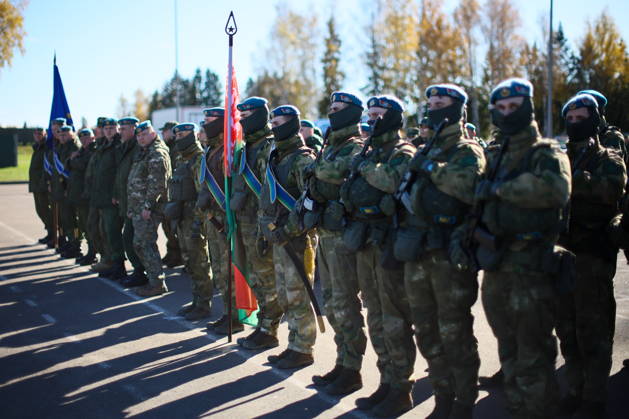 BELARUS - OCTOBER 16, 2026: Servicemen appear with national flags in the final live training phase of the Indestructible Brotherhood 2026 command-and-staff military exercise by the CSTO Peacekeeping Forces at the Losvido military training ground. Maxim Malinovsky TASS  99410877
