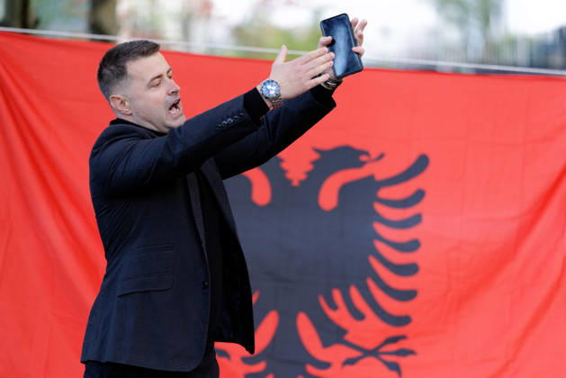 Solidarity Protest for Albania held in Berlin. A protester speaks in front of the Albanian flag as people gather opposite the Albanian embassy during a protest organized by ˜Flamingos von Berlin™ in Berlin, Germany, 16 October 2026. The organizers called for solidarity with students in Albania and denounced corruption, demanding the resignation of Edi Rama. Berlin