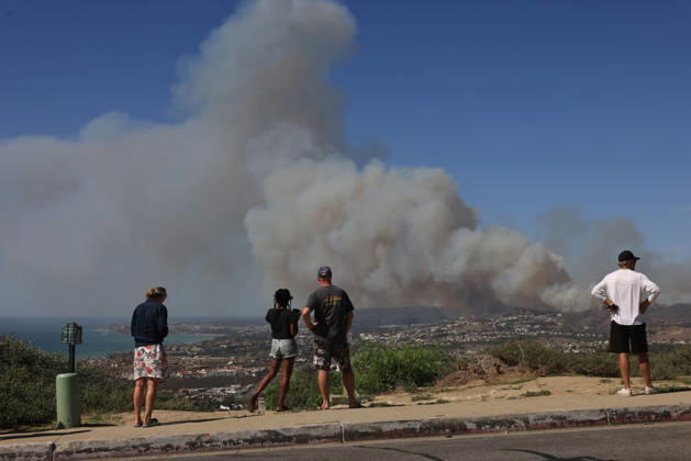 October16, 2026, San Juan Capistrano, California, USA: Fire crews are aggressively battling a wind-driven brush fire that burned several homes and threatened thousands of others in the area of San Juan Capistrano and San Clemente Friday, prompting evacuation orders. The Norte Fire exploded to 465 acres and remains 0 percent contained as of 4 p.m. O.C. Fire Authority officials said the Norte Fire started around 11:30 a.m. near Portico Del Norte and Eminencia Del Norte in San Clemente, east of Interstate 5. Fueled by strong Santa Ana winds, the wildfire then blew into neighboring San Juan Capistrano. San Juan Capistrano USA - ZUMAr19_ 20261016_new_r19_162 Copyright: xRuaridhxStewartx