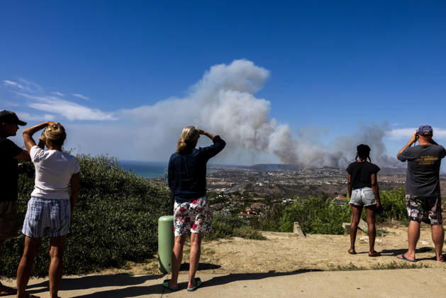 October16, 2026, San Juan Capistrano, California, USA: Fire crews are aggressively battling a wind-driven brush fire that burned several homes and threatened thousands of others in the area of San Juan Capistrano and San Clemente Friday, prompting evacuation orders. The Norte Fire exploded to 465 acres and remains 0 percent contained as of 4 p.m. O.C. Fire Authority officials said the Norte Fire started around 11:30 a.m. near Portico Del Norte and Eminencia Del Norte in San Clemente, east of Interstate 5. Fueled by strong Santa Ana winds, the wildfire then blew into neighboring San Juan Capistrano. San Juan Capistrano USA - ZUMAr19_ 20261016_new_r19_164 Copyright: xRuaridhxStewartx