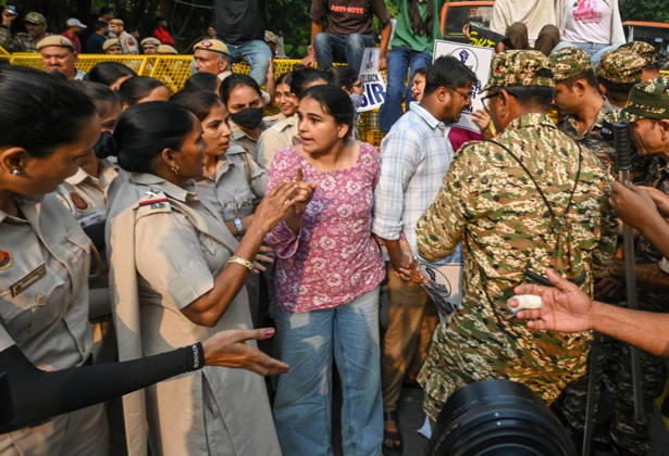 NEW DELHI, INDIA - OCTOBER 17: Delhi Police and paramilitary personnel detain members and workers of various organisations during a protest against Chief Election Commissioner Gyanesh Kumar and the Special Intensive Revision (SIR) of electoral rolls on Raisina Road on October 17, 2026 in New Delhi, India. (Photo by Raj K Raj Hindustan Times ) CJP Supporters Protest Demanding CEC Gyanesh Kumar s Resignation Over Voter List Changes