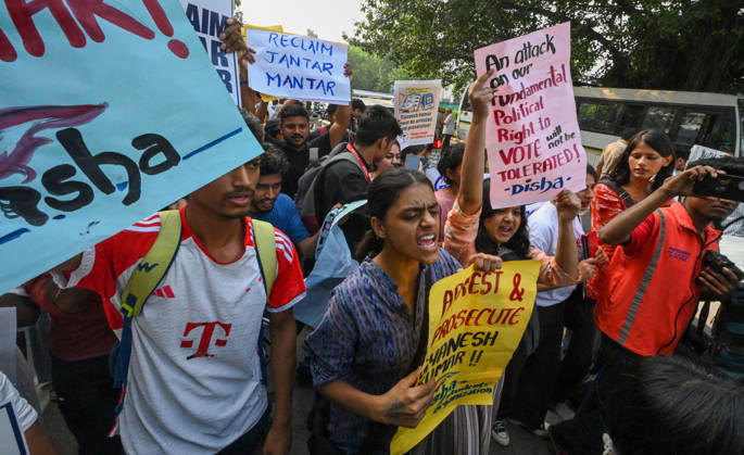NEW DELHI, INDIA - OCTOBER 17: Delhi Police and paramilitary personnel detain members and workers of various organisations during a protest against Chief Election Commissioner Gyanesh Kumar and the Special Intensive Revision (SIR) of electoral rolls on Raisina Road on October 17, 2026 in New Delhi, India. (Photo by Raj K Raj Hindustan Times ) CJP Supporters Protest Demanding CEC Gyanesh Kumar s Resignation Over Voter List Changes