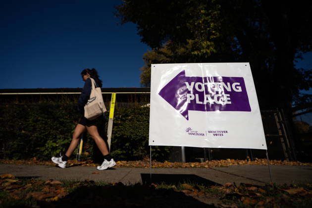 October 17, 2026, Port Moody, Bc, CANADA: A woman walks past a sign directing people to a polling station in Vancouver, on Saturday Oct. 17, 2026. British Columbians are heading to the polls to cast their votes in municipal elections being held across the province. Port Moody CANADA  - ZUMAc35_ 20261017_zaf_c35_016 Copyright: xEthanxCairnsx