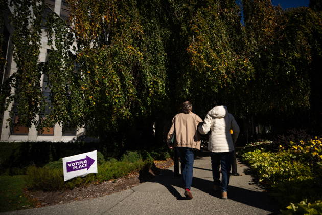 October 17, 2026, Port Moody, Bc, CANADA: People walk past a sign directing to a polling station in Vancouver, on Saturday Oct. 17, 2026. British Columbians are heading to the polls to cast their votes in municipal elections being held across the province. Port Moody CANADA  - ZUMAc35_ 20261017_zaf_c35_017 Copyright: xEthanxCairnsx