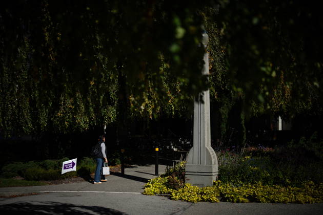 October 17, 2026, Port Moody, Bc, CANADA: A woman walks past a sign directing people to a polling station in Vancouver, on Saturday Oct. 17, 2026. British Columbians are heading to the polls to cast their votes in municipal elections being held across the province. Port Moody CANADA  - ZUMAc35_ 20261017_zaf_c35_018 Copyright: xEthanxCairnsx