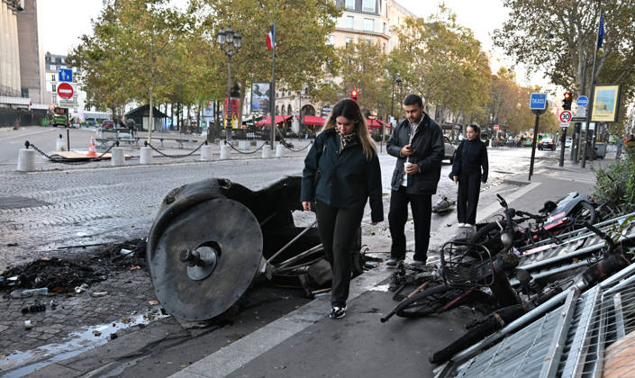 Aftermath of clashes during nationwide protests in Paris PARIS, FRANCE - OCTOBER 18: People walk past burnt-out bicycles following clashes during nationwide protests against the high cost of living and rising fuel prices in Paris, France on October 18, 2026. Mustafa Yalcin Anadolu Paris France. Editorial use only. Please get in touch for any other usage.  Copyright: x2026xAnadoluxMustafaxYalcinx