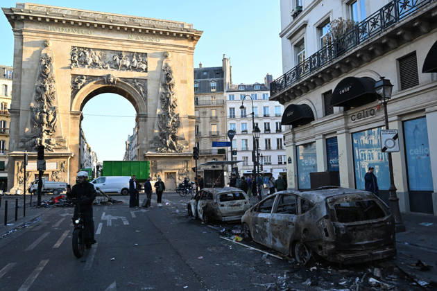Aftermath of clashes during nationwide protests in Paris PARIS, FRANCE - OCTOBER 18: A person walks past burnt-out vehicles following clashes during nationwide protests against the high cost of living and rising fuel prices in Paris, France on October 18, 2026. Mustafa Yalcin Anadolu Paris France. Editorial use only. Please get in touch for any other usage.  Copyright: x2026xAnadoluxMustafaxYalcinx